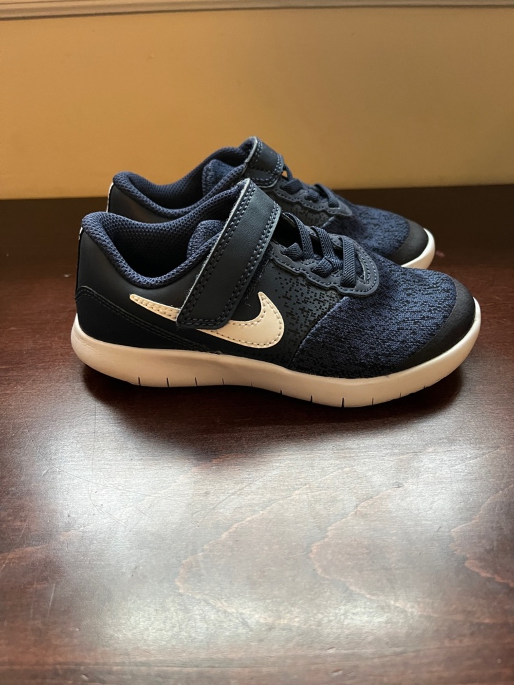 Navy and black Nike sneakers with Velcro, size 10.5. Worn 1-2x.
